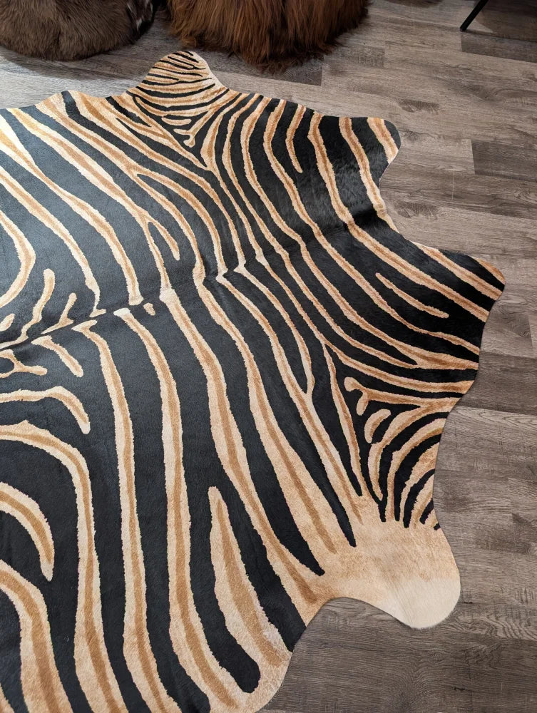 Black and tan zebra print large cowhide rug with unique characteristics by angus oliver perfect for stylish decor