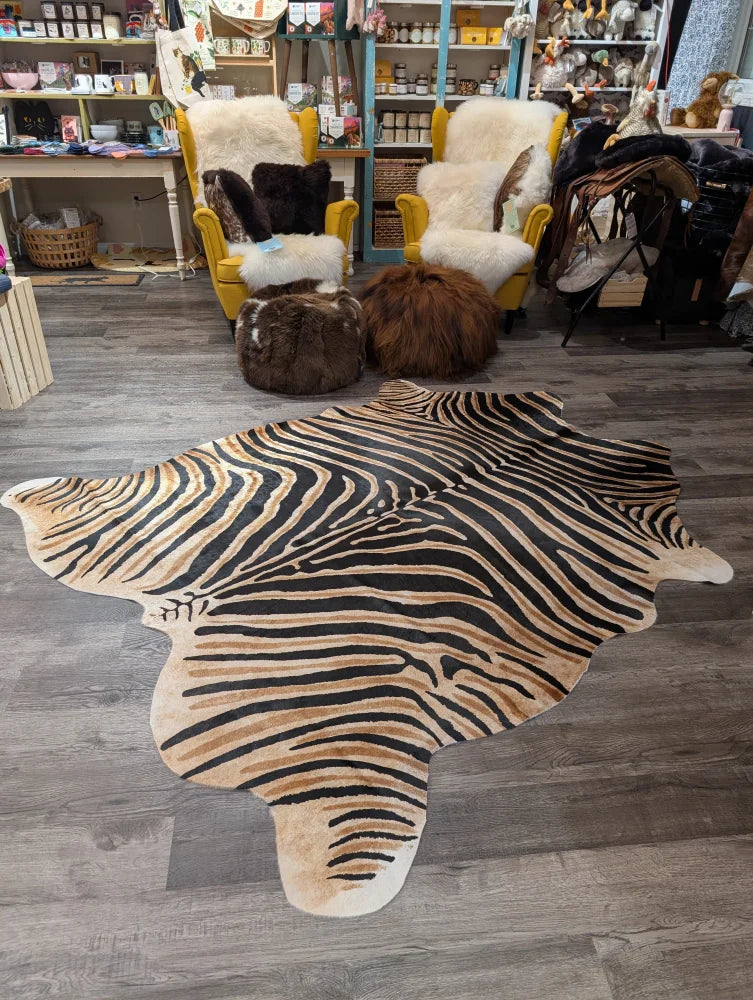 Gorgeous zebra printed large angus oliver cowhide rug with bold black and tan stripes and unique characteristics
