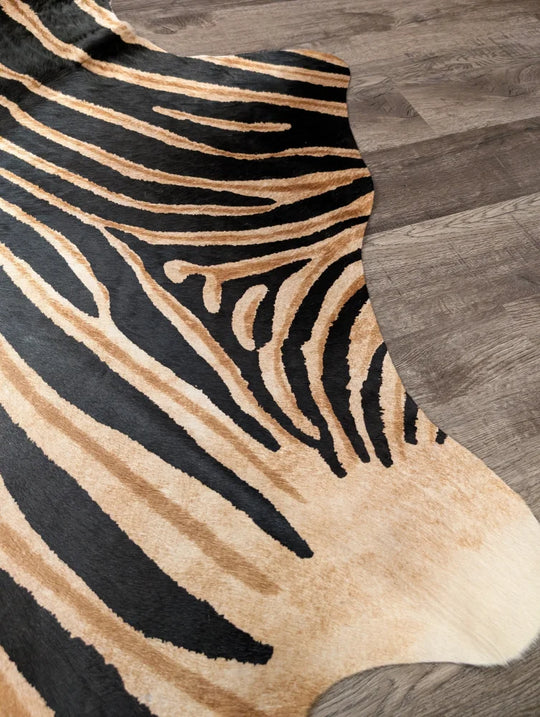 Black and tan zebra striped large cowhide rug by angus oliver with unique characteristics and natural textured surface