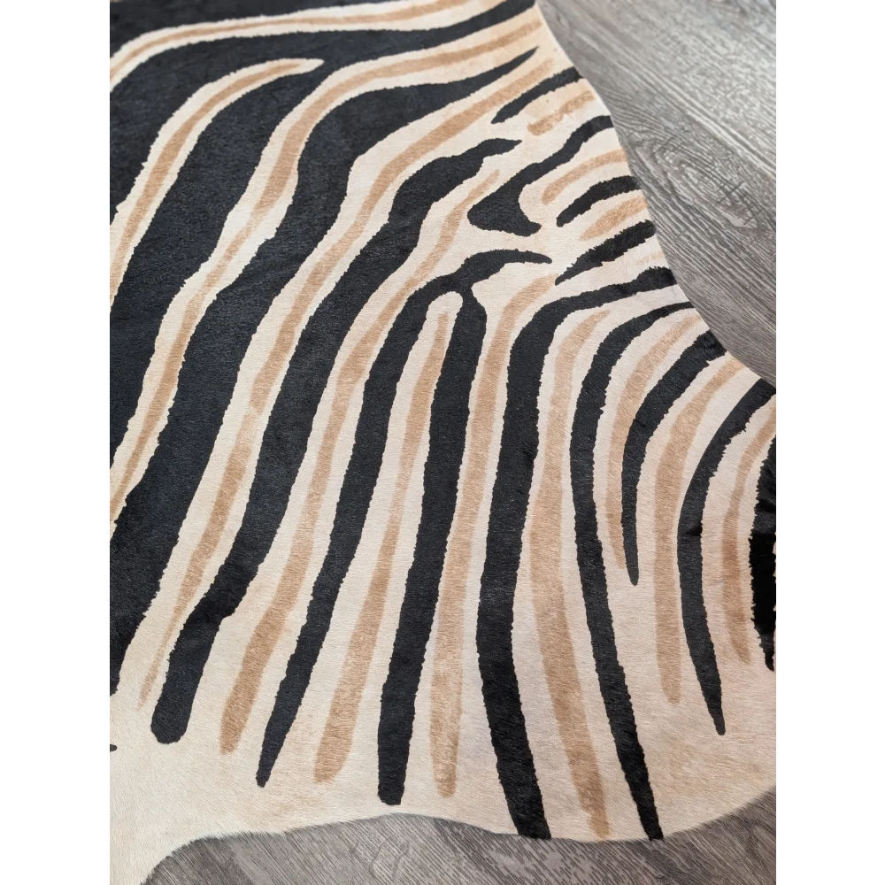 Large cowhide zebra printed faux fur rug in black and beige with unique characteristics by angus oliver