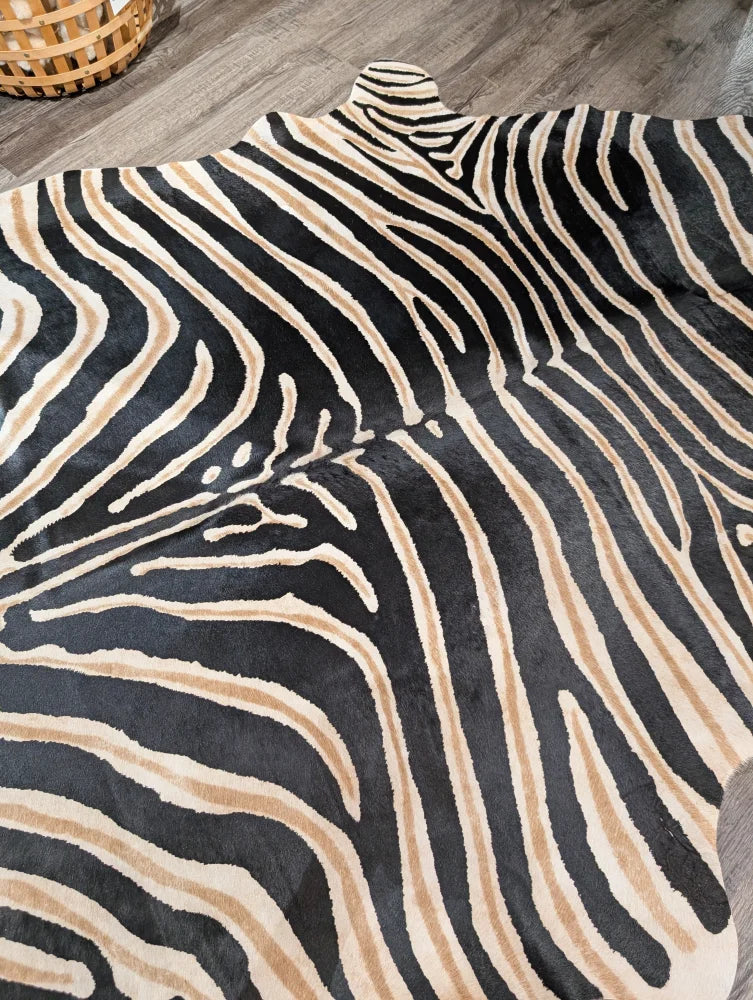 Large cowhide zebra printed faux leather rug in black and beige with unique characteristics by angus oliver