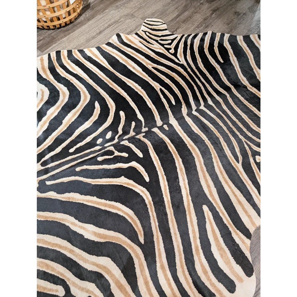 Large cowhide zebra printed faux leather rug in black and beige with unique characteristics by angus oliver