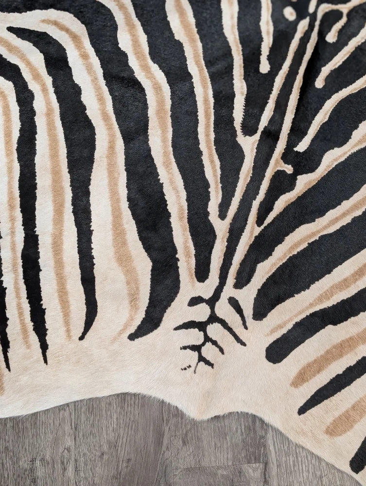 Large cowhide zebra printed rug in black and beige with unique frayed edge by angus oliver perfect for decor