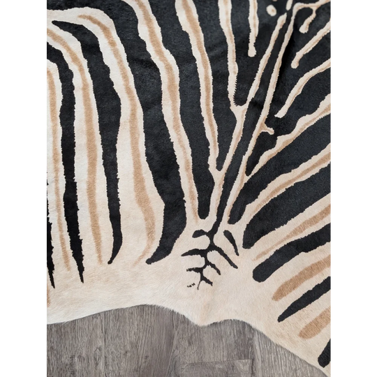 Large cowhide zebra printed rug in black and beige with unique frayed edge by angus oliver perfect for decor