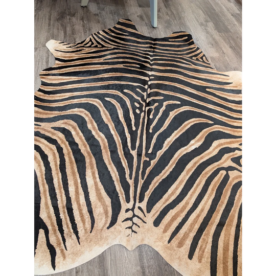 Large cowhide zebra printed faux leather rug in black and tan with unique characteristics by angus oliver