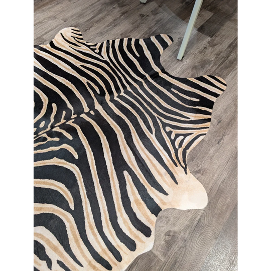 Large cowhide zebra printed faux leather rug in black and beige with unique characteristics by angus oliver