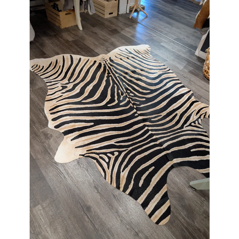 Large cowhide zebra printed rug in black and cream with unique characteristics by angus oliver 90 x 70 inches