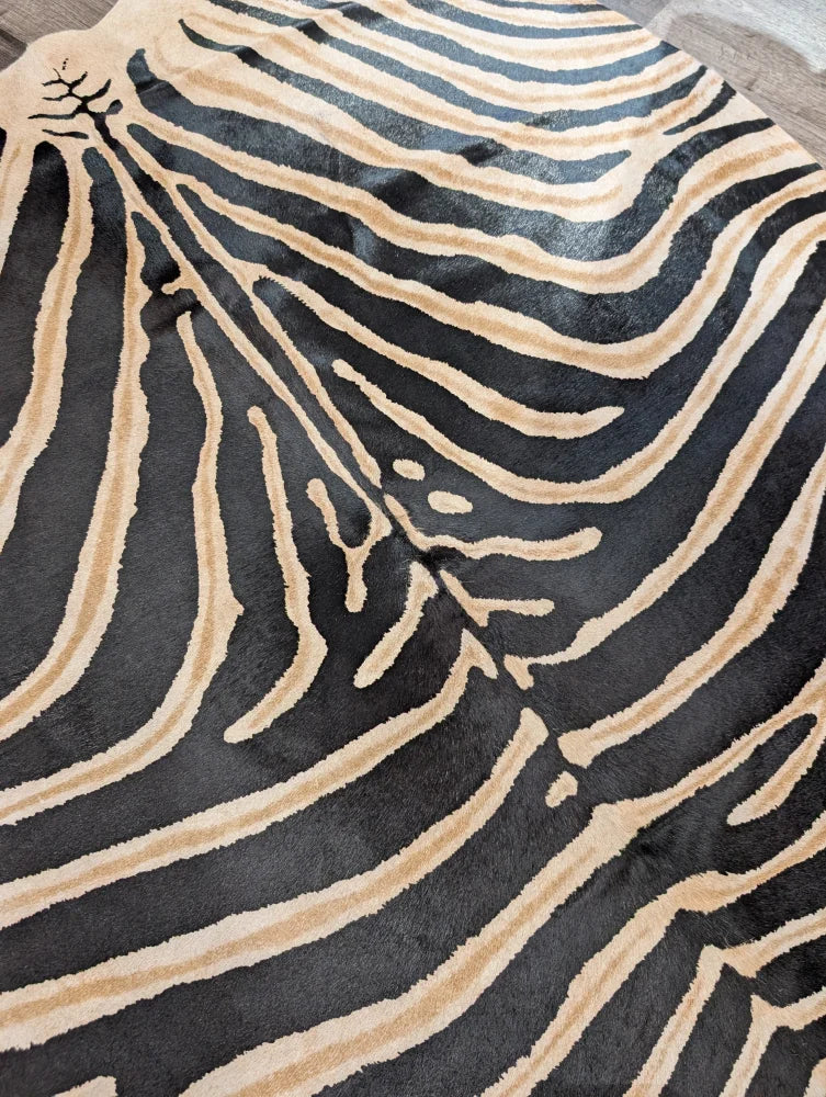 Black and tan zebra striped large cowhide rug by angus oliver with plush textured surface and unique characteristics