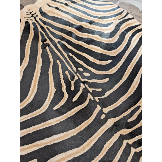 Black and tan zebra striped large cowhide rug by angus oliver with plush textured surface and unique characteristics