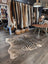 Large black and cream zebra printed cowhide rug with unique characteristics by angus oliver perfect as a statement piece