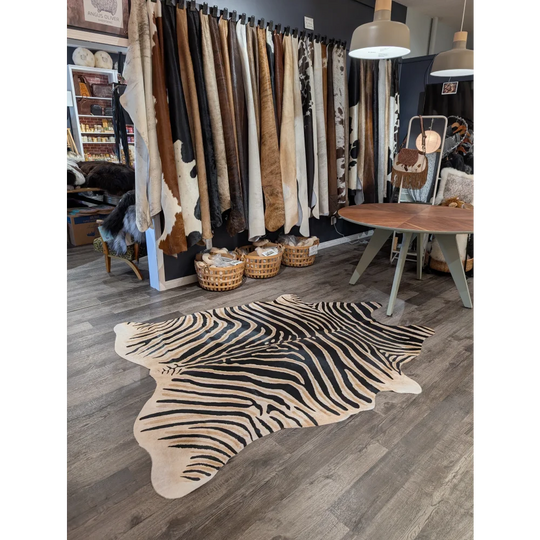 Large black and cream zebra printed cowhide rug with unique characteristics by angus oliver perfect as a statement piece