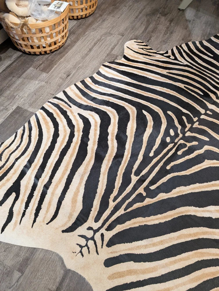 Large cowhide faux leather rug with unique black and beige zebra stripes by angus oliver perfect for bold decor