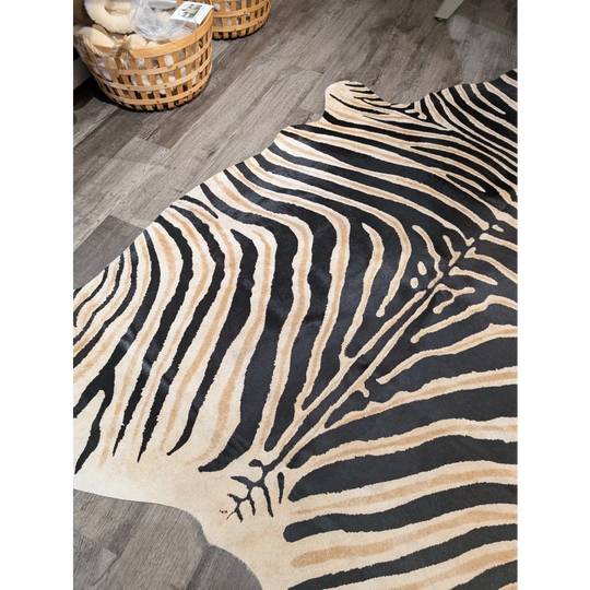 Large cowhide faux leather rug with unique black and beige zebra stripes by angus oliver perfect for bold decor