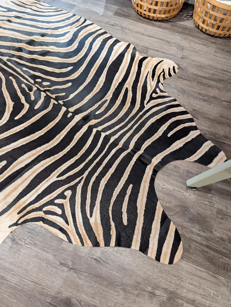 Large cowhide zebra printed faux leather rug in black and cream with unique characteristics by angus oliver