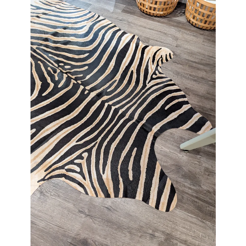 Large cowhide zebra printed faux leather rug in black and cream with unique characteristics by angus oliver